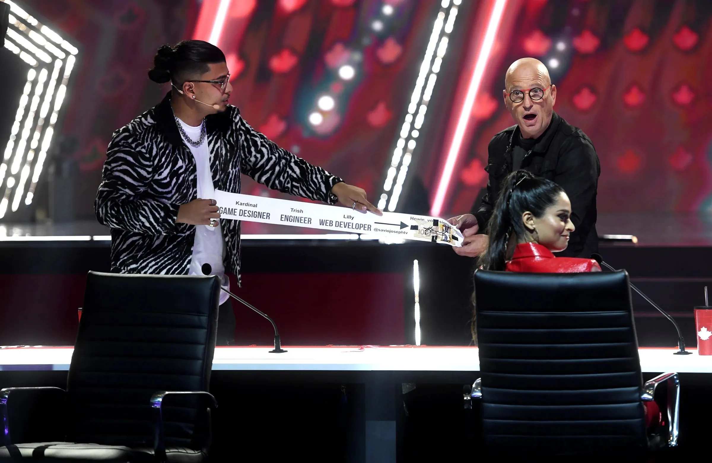 Savio Joseph on the Canada's Got Talent stage as judge Howie Mandel reacts, open-mouthed